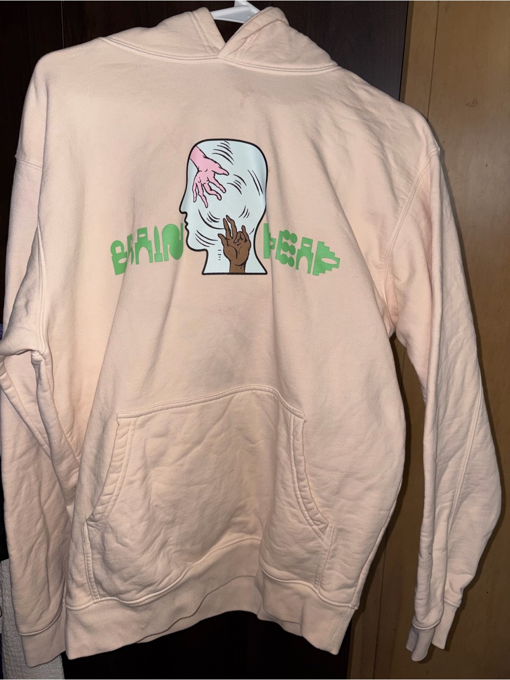 Beige Graphic Hoodie with Hand Illustration